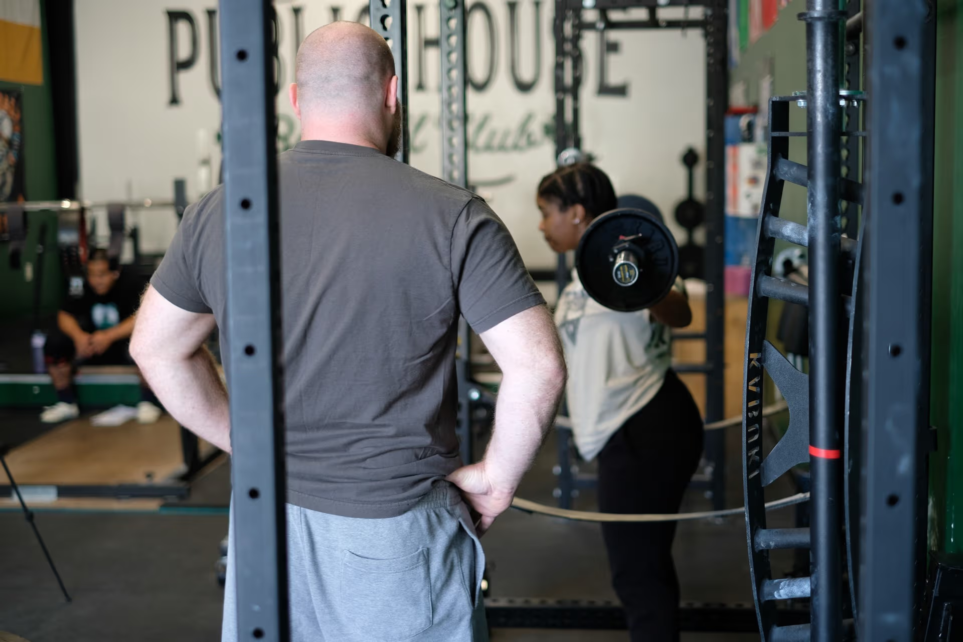 Coaches and lifters training together at Public House Barbell Club